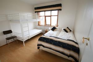 Double room with shared bathroom and an additional bunk bed