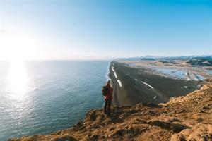 Hiking for stunning views over black sand beach in Iceland