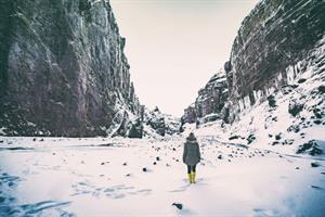 Walking into a snowy canyon