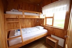 A room with a bunk bed
