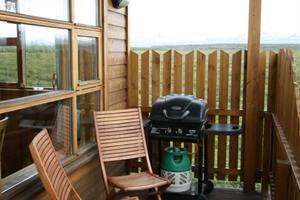 A BBQ and a part of the veranda