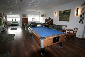 Living room with a pool table