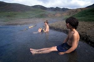 Relaxing in the hot river during the hot spring tour